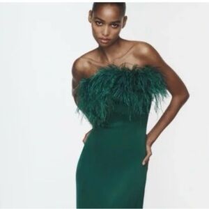 Never been worn withh tags on. Knee length Zara feather straplesss satin dress.